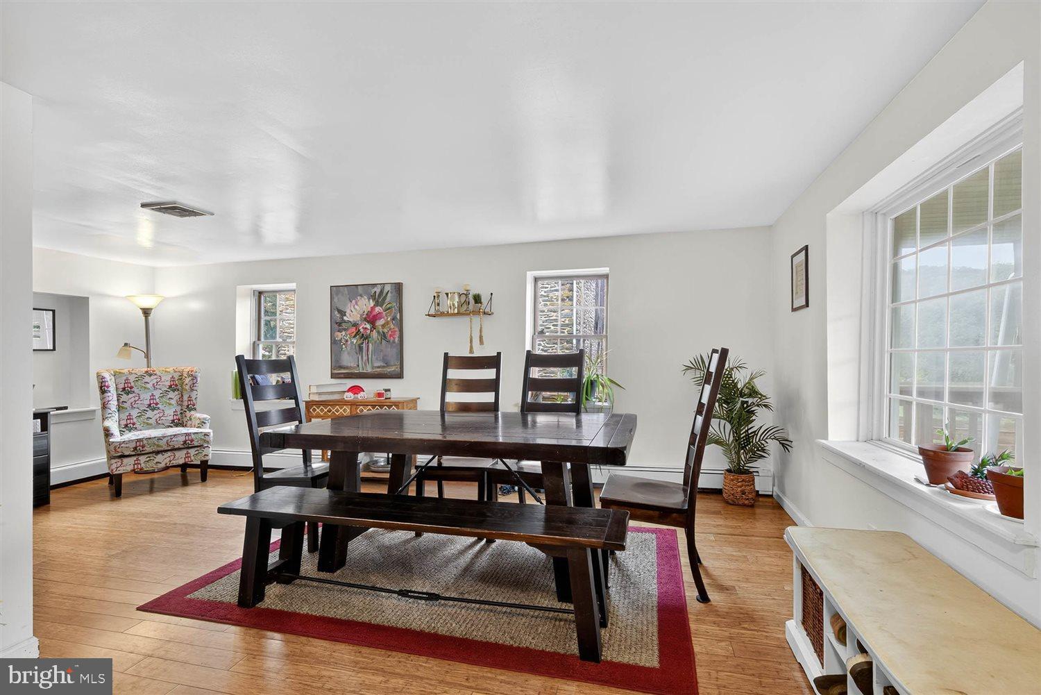 5987 River Road Conestoga, PA 17516 - Photo 5 of 40 a view of a dining room with furniture window and wooden floor