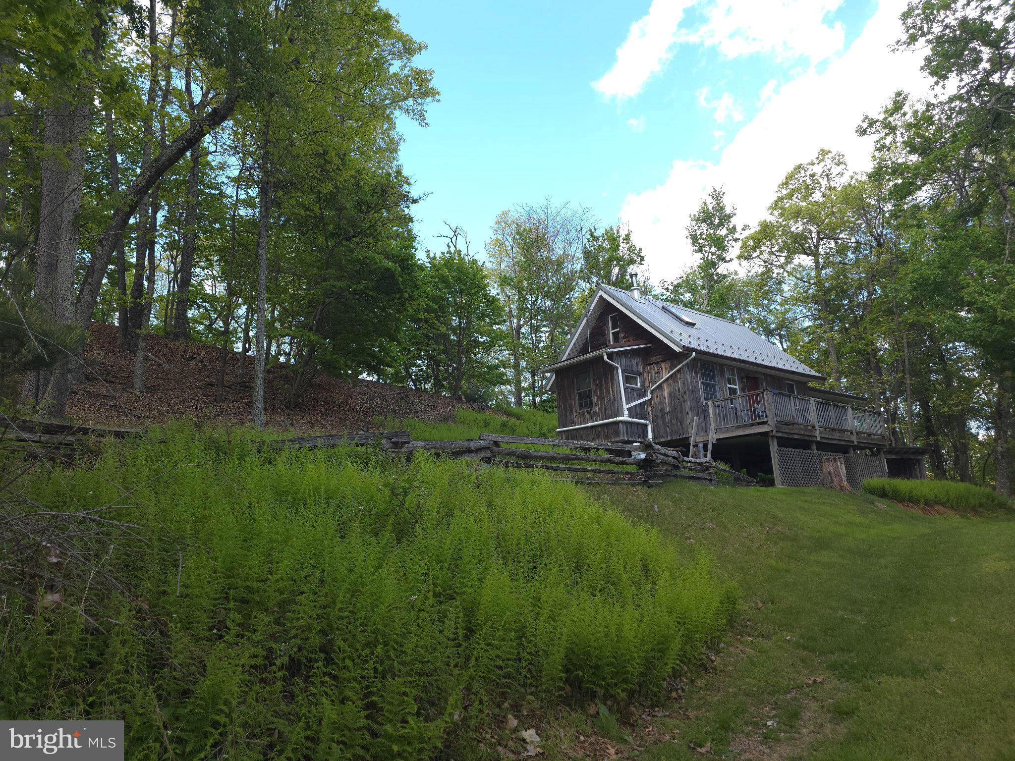 152 Sharp Ridge Lane Franklin, WV 26807 - Photo 5 of 53 a backyard of a house with table and chairs