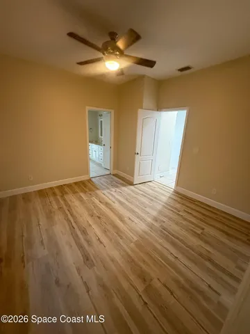 a view of a big house with a big yard