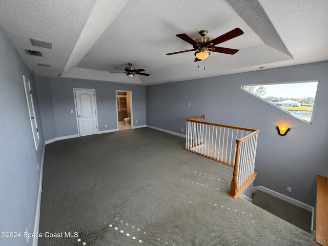 a front view of house with yard and trees