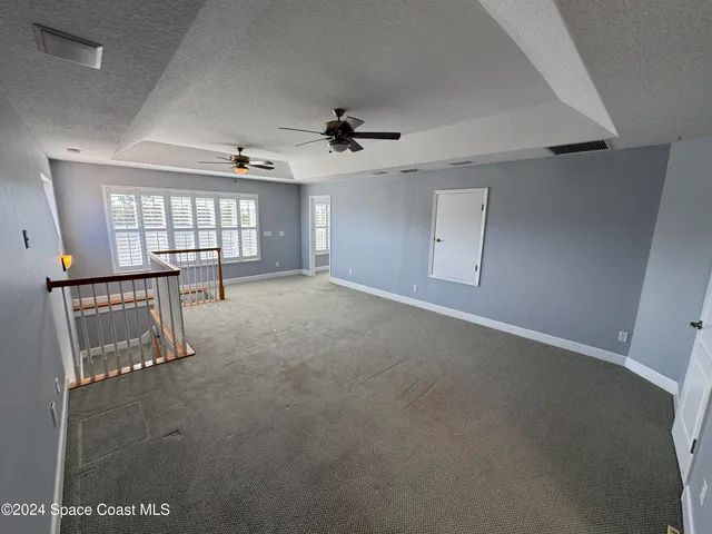 a view of a street with an ocean view