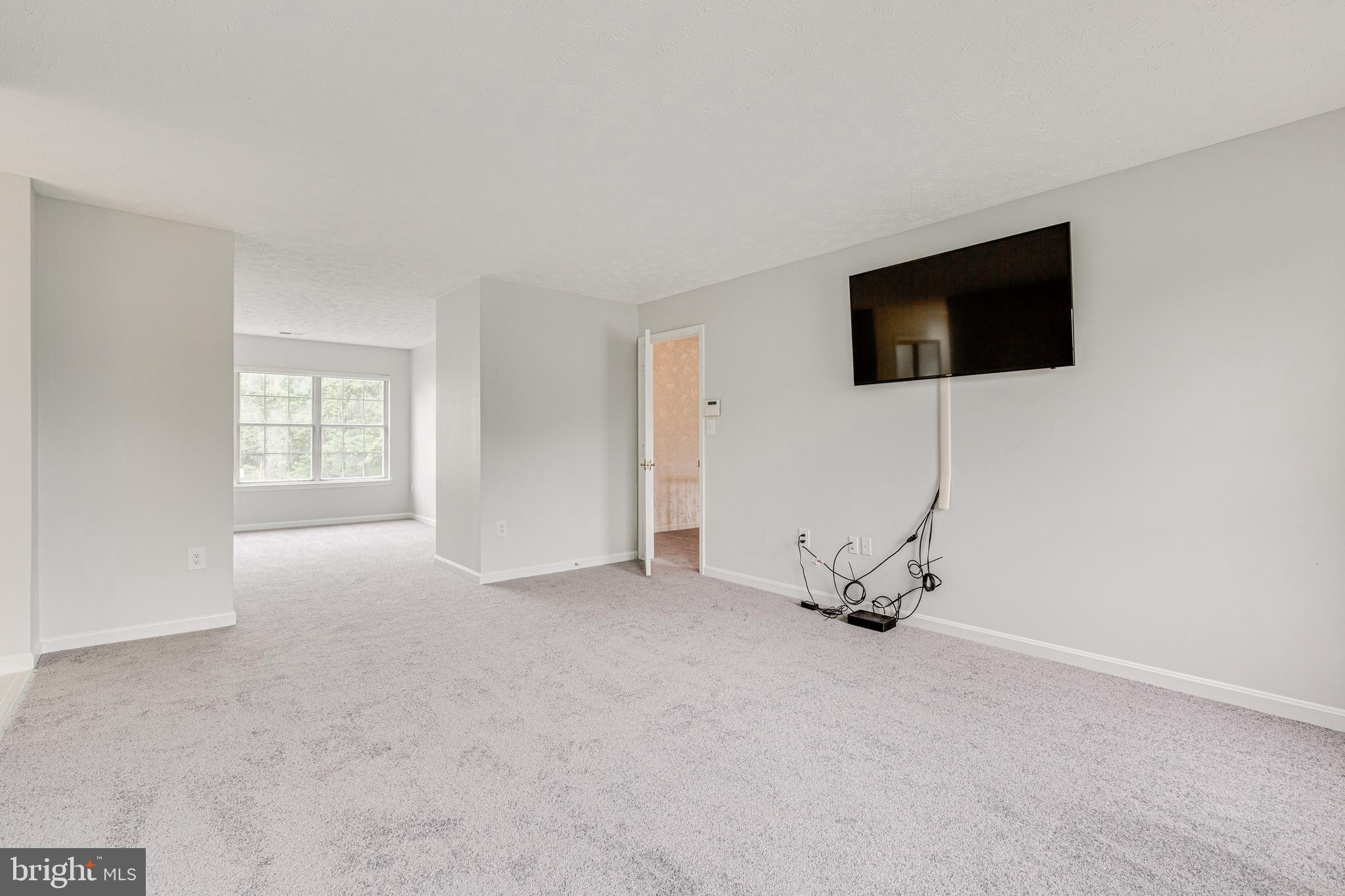 9601 Bald Hill Road Bowie, MD 20721 - Photo 25 of 51 Master Bedroom with Flat Screen TV Conveys