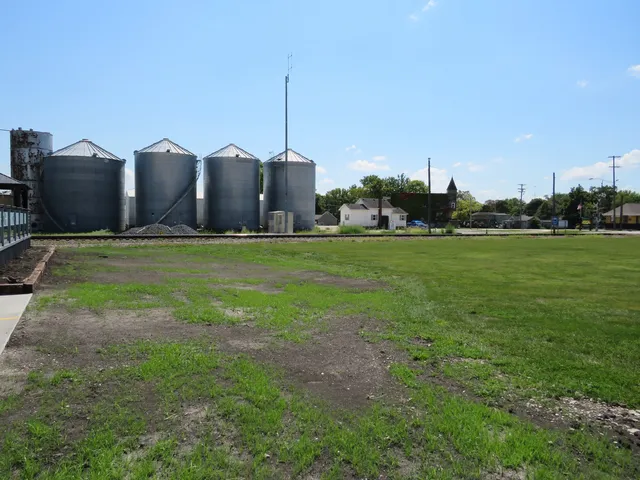 a view of a field with an ocean view