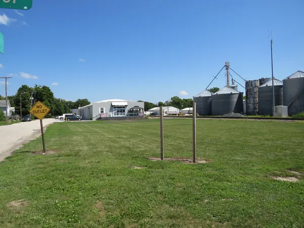 a house view with a play ground in front of it