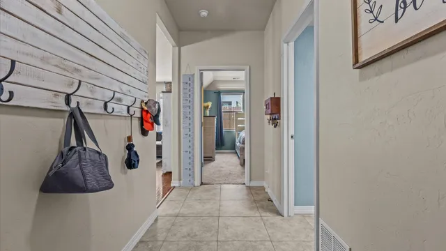 a view of a hallway with a outdoor space