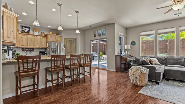 a large kitchen with a table and chairs