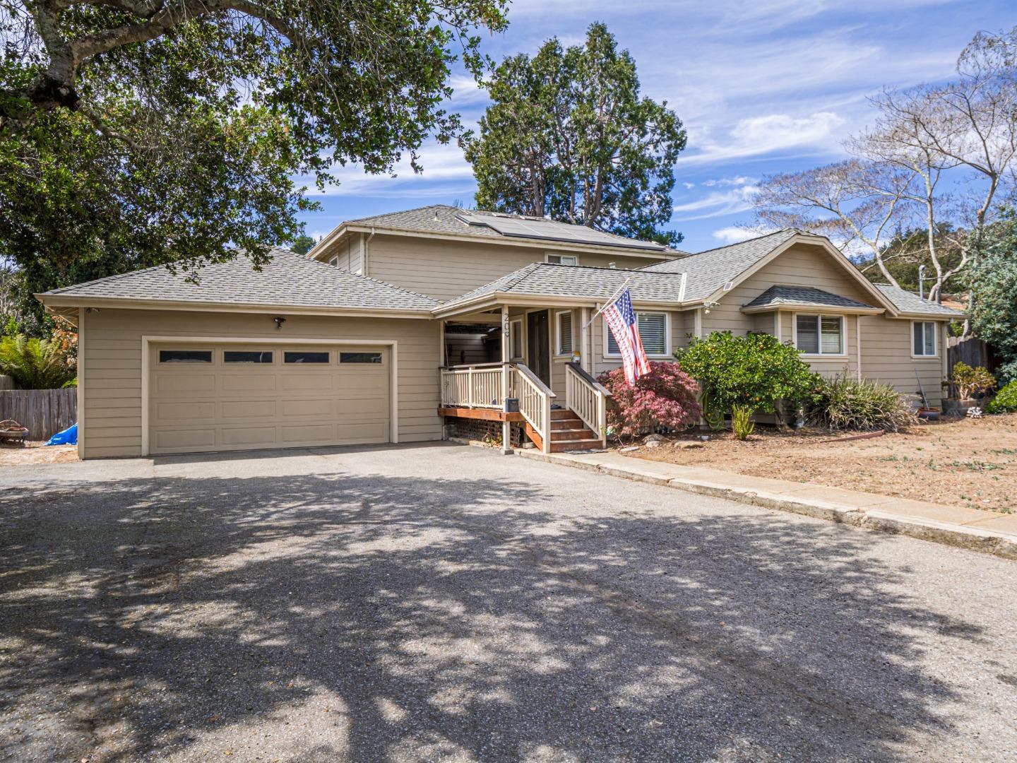 209 Hames Road Watsonville, CA 95076 - Photo 3 of 60 a front view of a house with a yard and garage