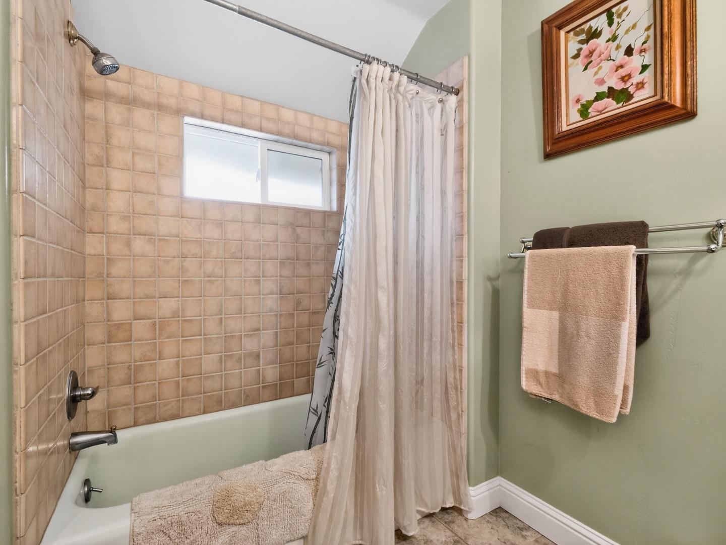 209 Hames Road Watsonville, CA 95076 - Photo 49 of 60 a bathroom with a shower and a bathtub