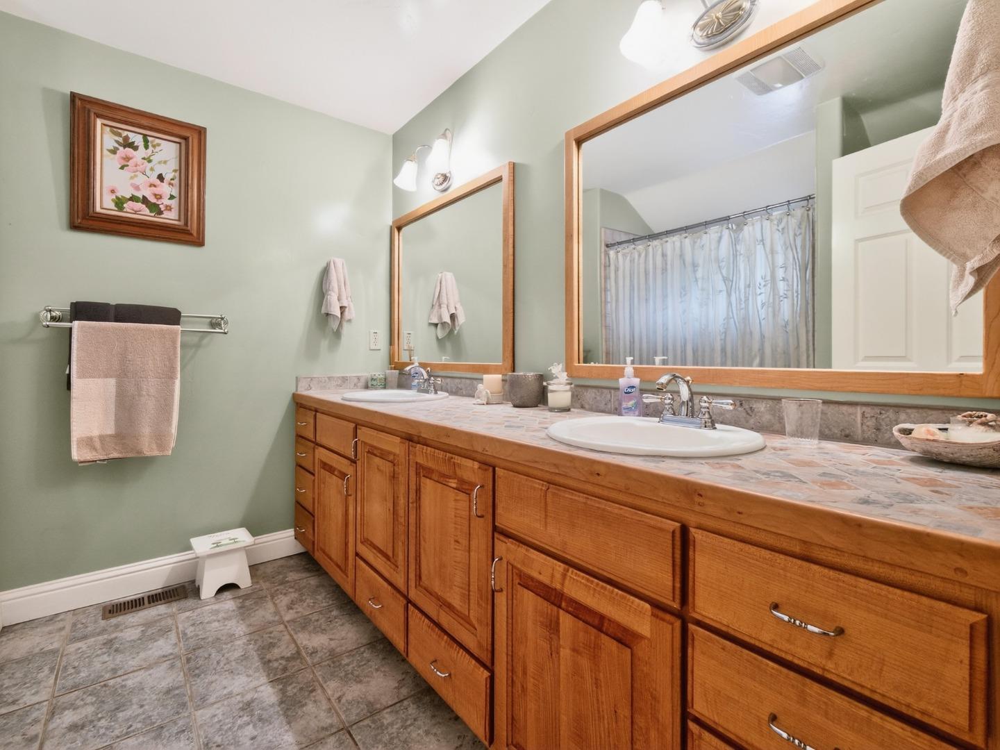 209 Hames Road Watsonville, CA 95076 - Photo 50 of 60 a bathroom with a granite countertop sink mirror and toilet