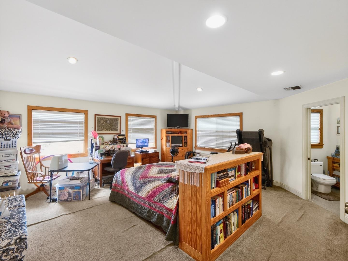 209 Hames Road Watsonville, CA 95076 - Photo 53 of 60 a bed room with a bed and a chair