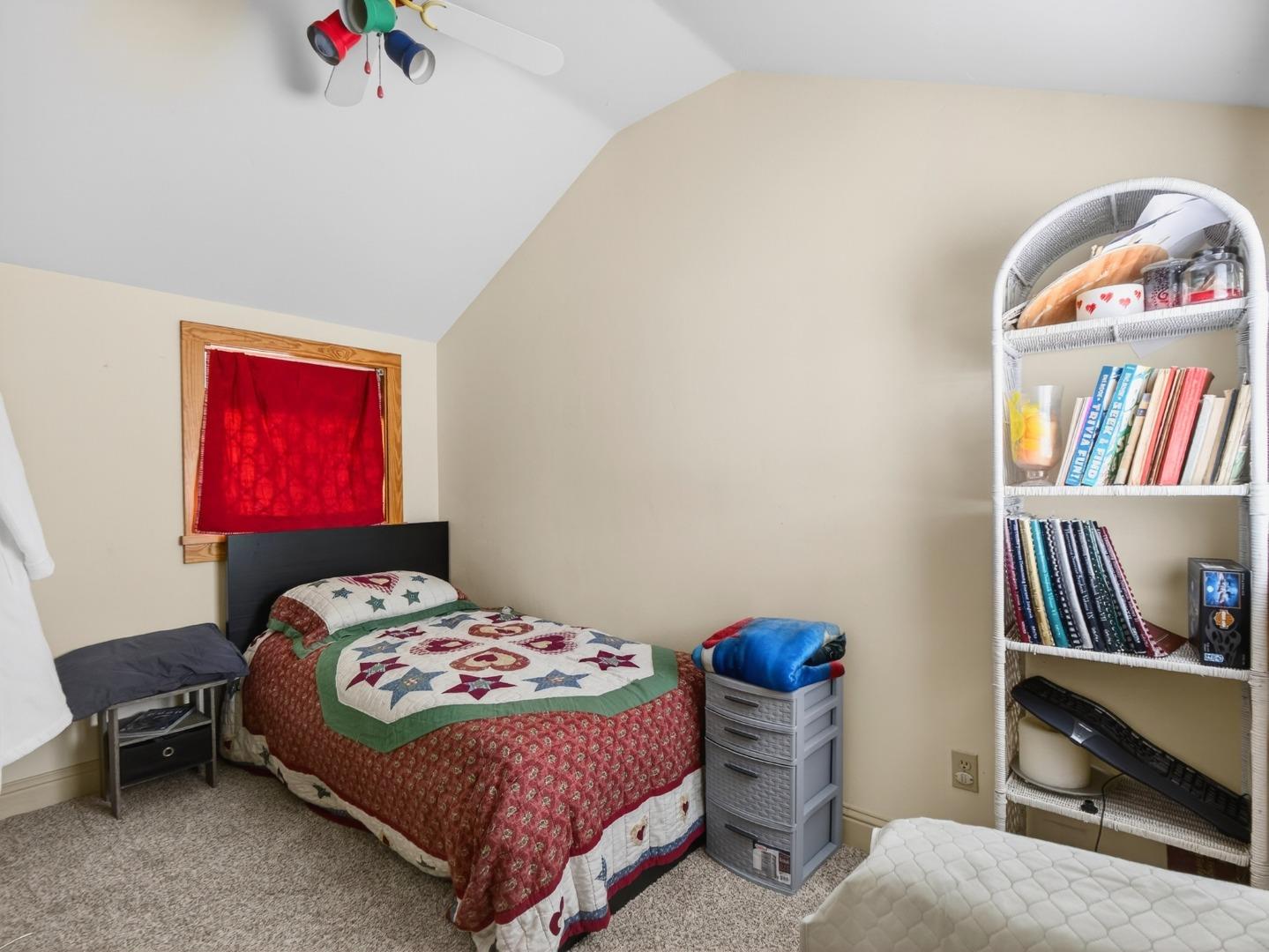 209 Hames Road Watsonville, CA 95076 - Photo 60 of 60 a bedroom with a bed a dresser and book shelf