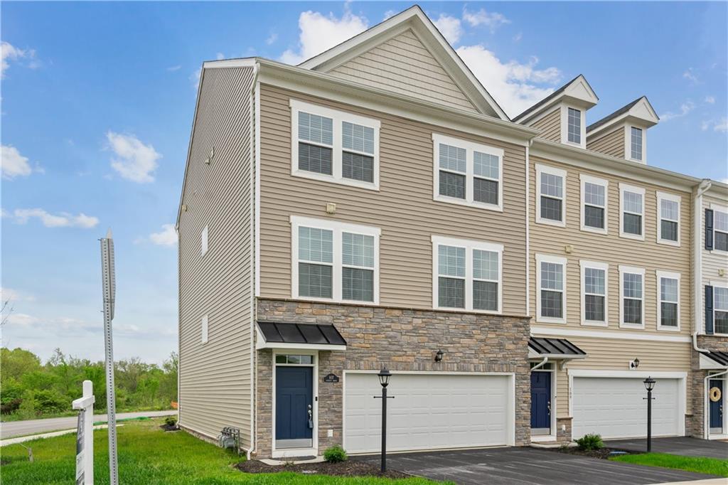 107 Affinity Drive Harmony, PA 16037 - Photo 1 of 49 a front view of a house with a yard