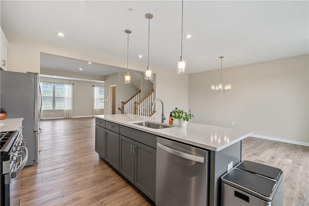 107 Affinity Drive Harmony, PA 16037 - Photo 17 of 49 a kitchen with a sink and stove top oven