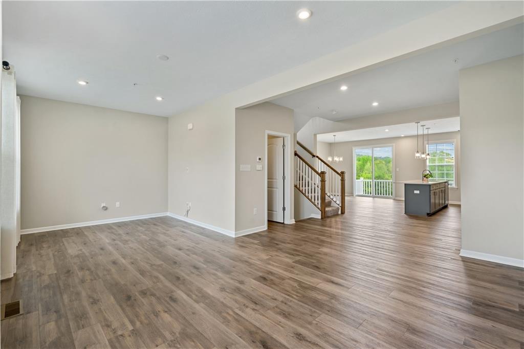 107 Affinity Drive Harmony, PA 16037 - Photo 19 of 49 a view of an empty room with wooden floor and a window