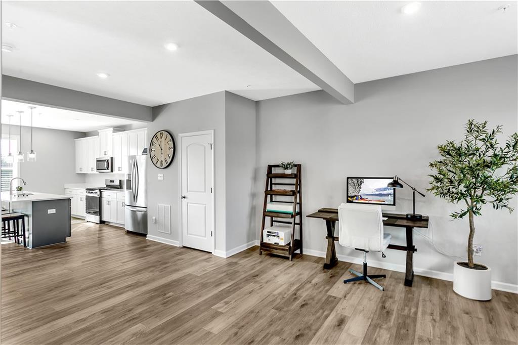 107 Affinity Drive Harmony, PA 16037 - Photo 22 of 49 a view of a workspace with furniture and a potted plant