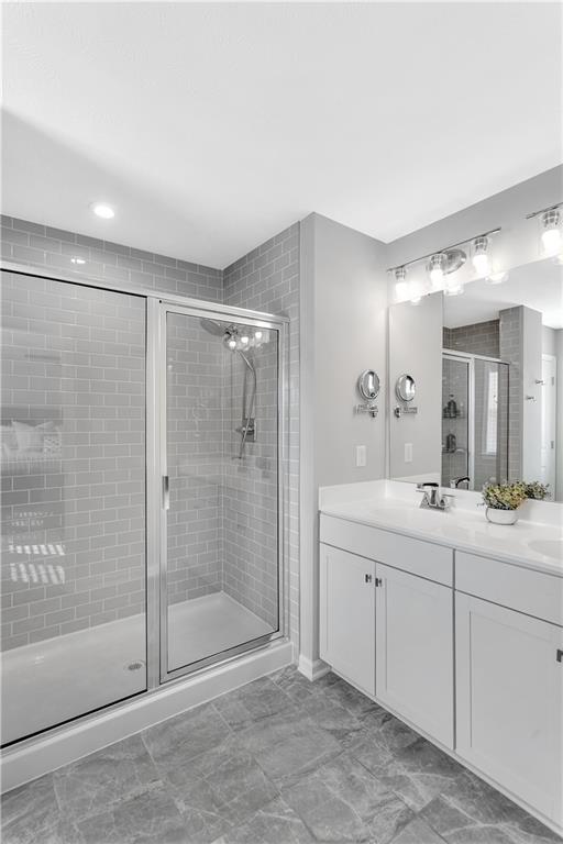 107 Affinity Drive Harmony, PA 16037 - Photo 34 of 49 a spacious bathroom with a shower a sink and mirror