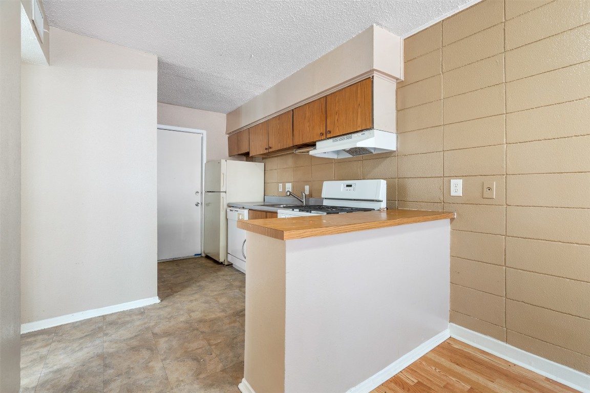 311 East 31st Street, Unit 107 Austin, TX 78705 - Photo 8 of 21 a view of storage and utility room with washer and dryer