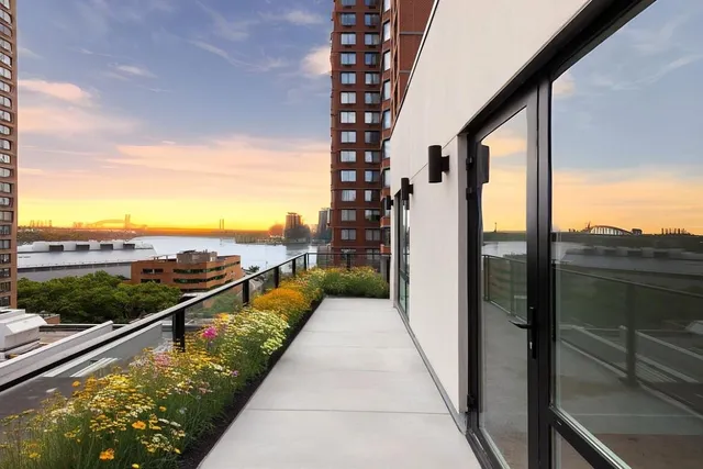 a bathroom with a shower and a glass door