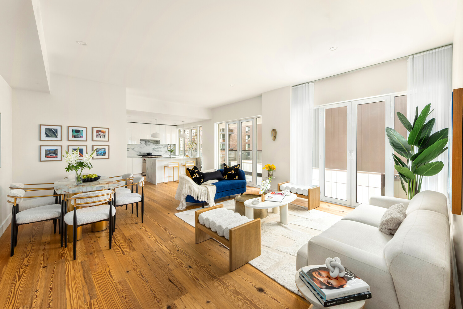 427 East 90th Street, Unit PH9/10 Manhattan, NY 10128 - Photo 3 of 27 a living room with furniture and a wooden floor