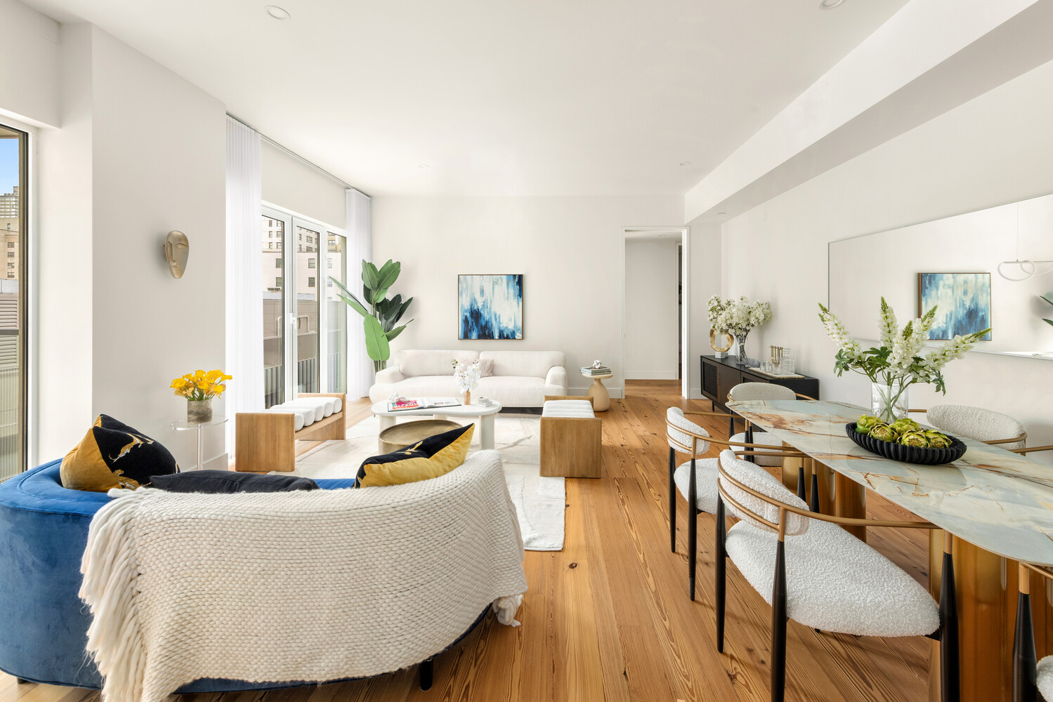 427 East 90th Street, Unit PH9/10 Manhattan, NY 10128 - Photo 4 of 27 a living room with furniture and wooden floor