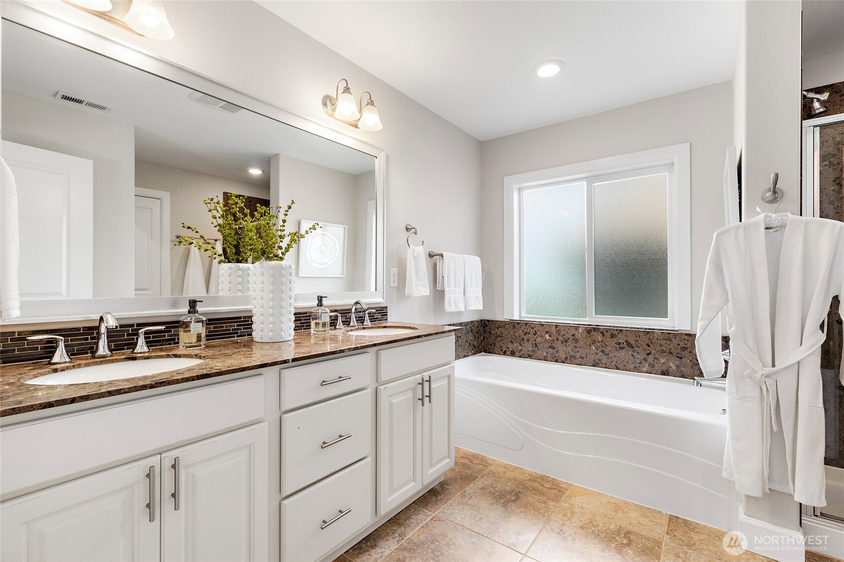 4000 174th Street Southeast Bothell, WA 98012 - Photo 23 of 39 a bathroom with a granite countertop tub a sink and a large mirror