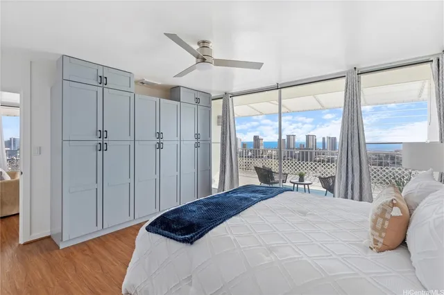 a bedroom with a large bed and a large window