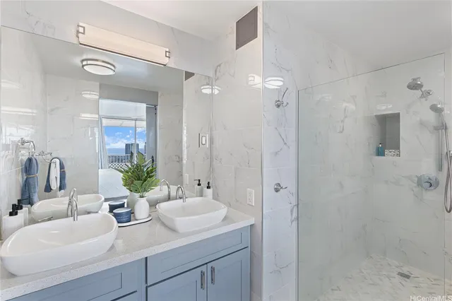 a bathroom with double sink and a mirror