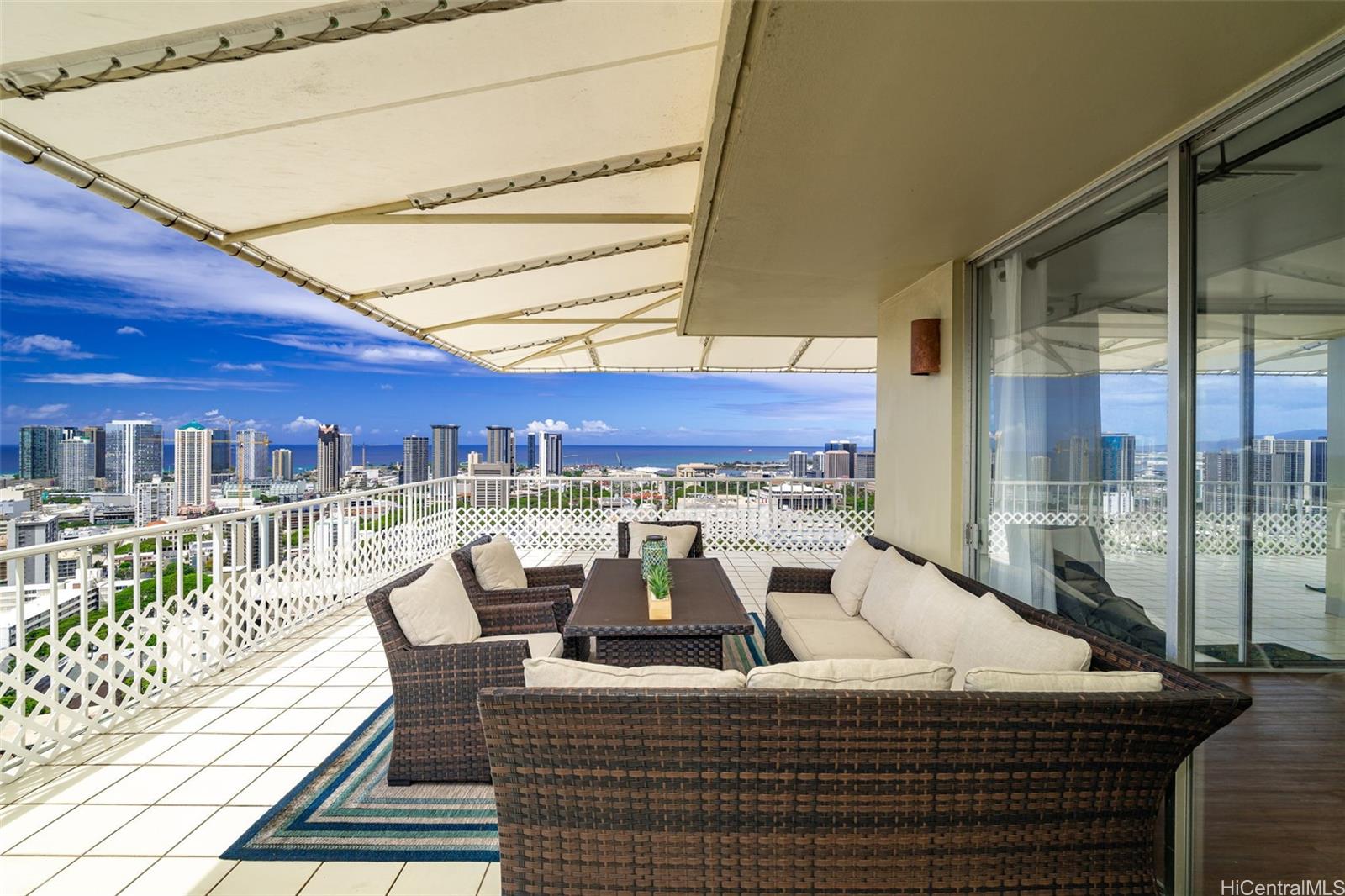 666 Prospect Street, Unit PH B Honolulu, HI 96813 - Photo 2 of 24 a view of a patio with a table and chairs