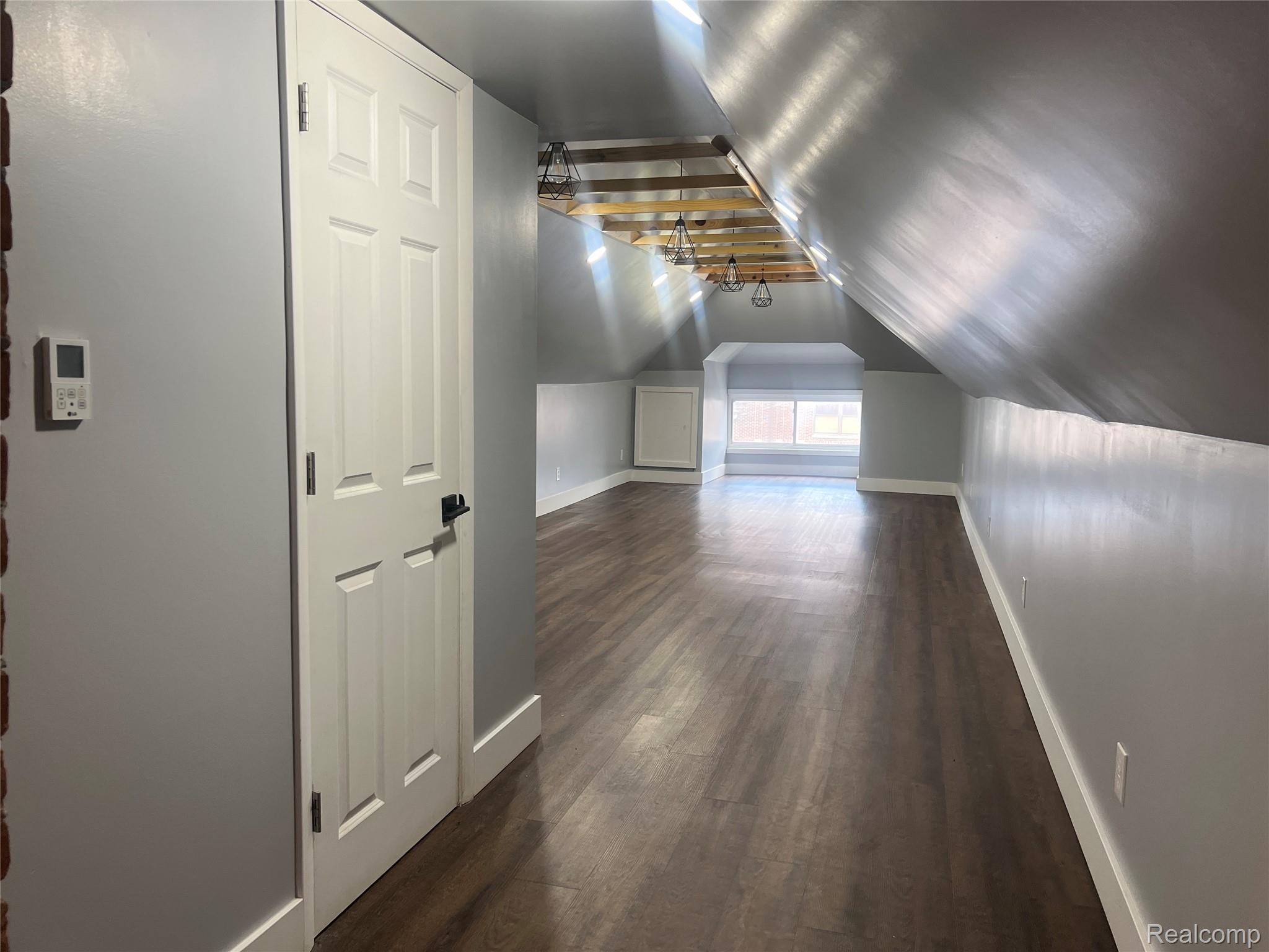 132 Pilgrim Street, Unit STUDIO 3 Highland Park, MI 48203 - Photo 2 of 10 Spacious studio with exposed ceiling beams with pendant lighting