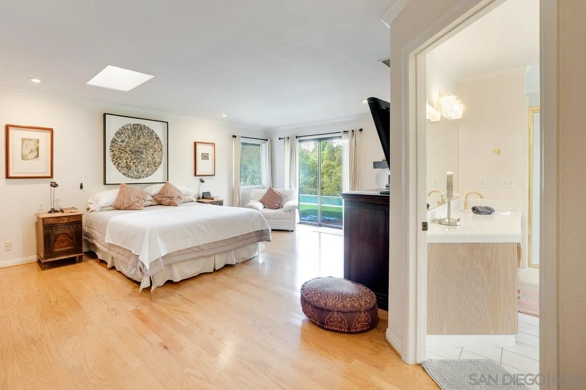 11 Country Glen Road Fallbrook, CA 92028 - Photo 23 of 75 a bedroom with a bed and a large mirror