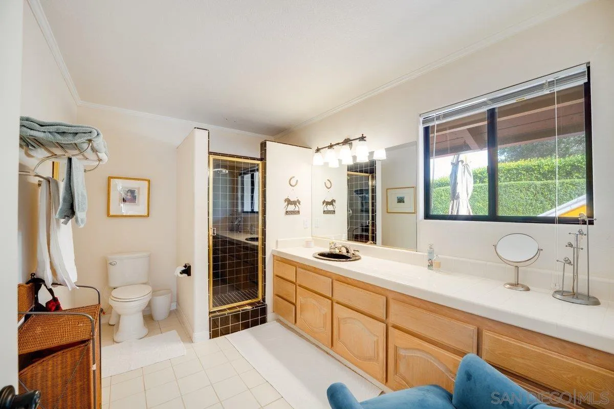 11 Country Glen Road Fallbrook, CA 92028 - Photo 28 of 75 a spacious bathroom with a double vanity sink a mirror and a bathtub