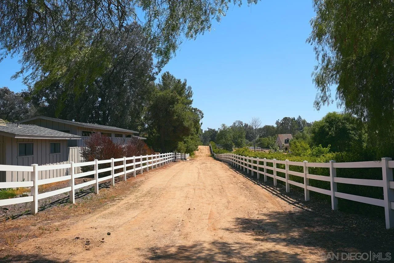 11 Country Glen Road Fallbrook, CA 92028 - Photo 72 of 75 a view of a roof deck with wooden floor and fence