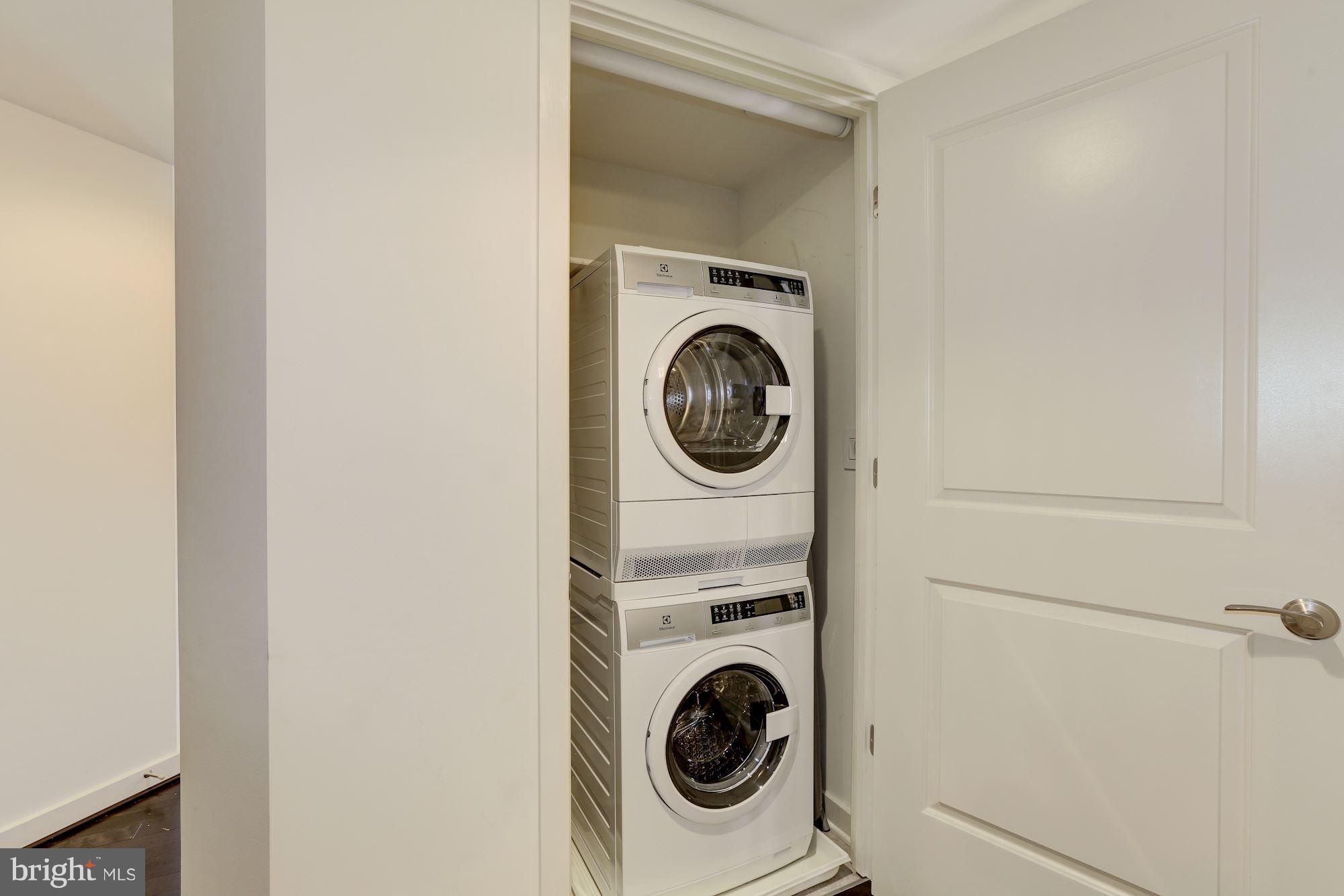 1025 First Street Southeast, Unit 916 Washington, DC 20003 - Photo 8 of 30 a utility room with dryer and washer