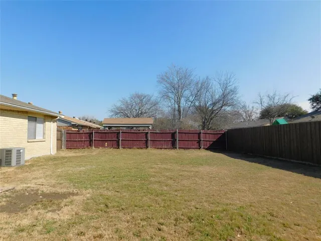 a house view with a backyard space