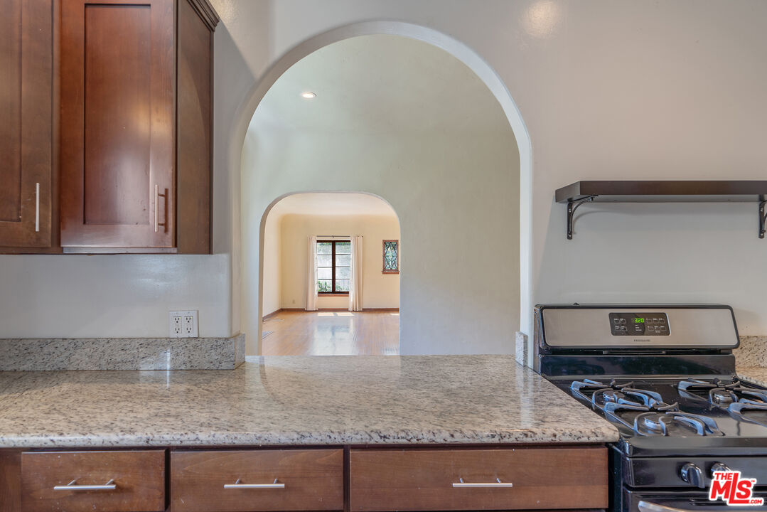 458 North Genesee Avenue Los Angeles, CA 90036 - Photo 13 of 38 a view of kitchen with stainless steel appliances granite countertop a stove and a sink