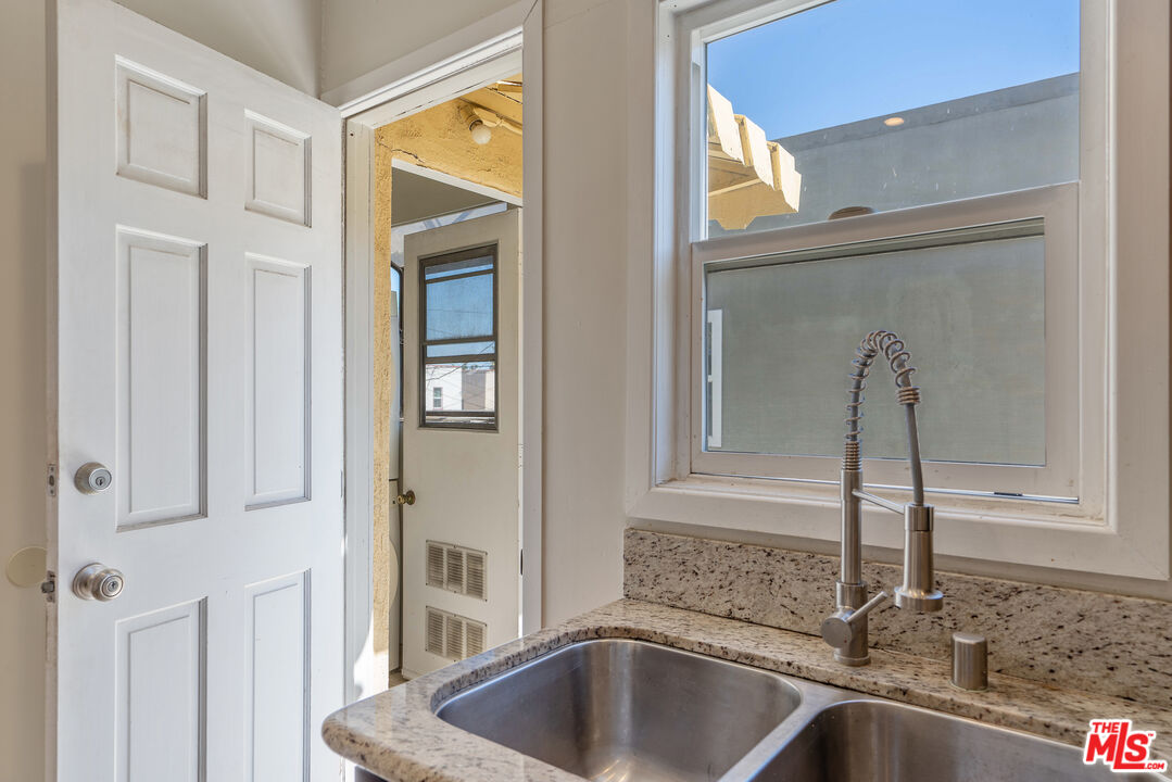 458 North Genesee Avenue Los Angeles, CA 90036 - Photo 14 of 38 a kitchen with a sink and a window