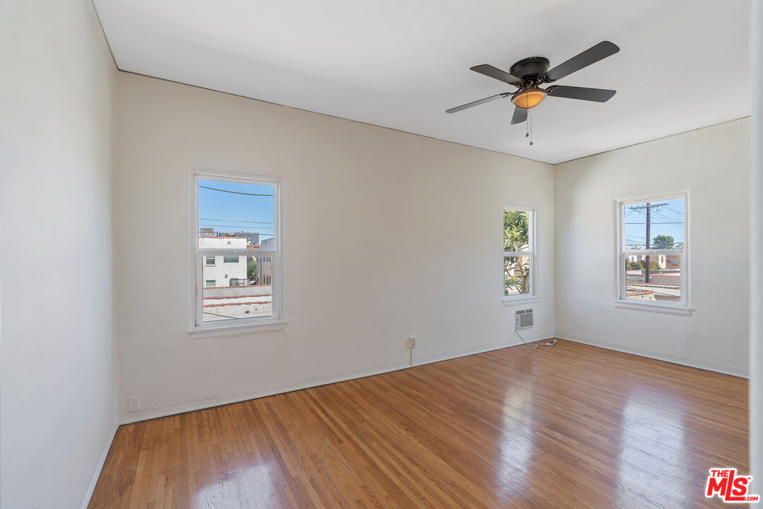 458 North Genesee Avenue Los Angeles, CA 90036 - Photo 21 of 38 a view of a big room with wooden floor and windows