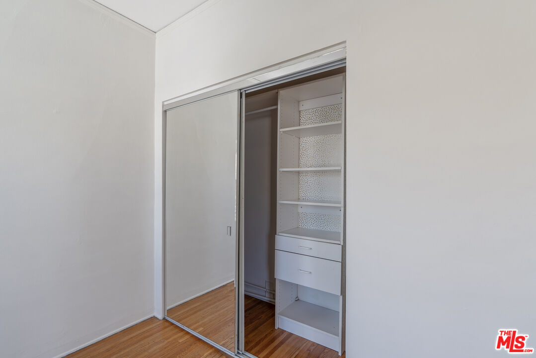 458 North Genesee Avenue Los Angeles, CA 90036 - Photo 23 of 38 a view of walk in closet with empty racks