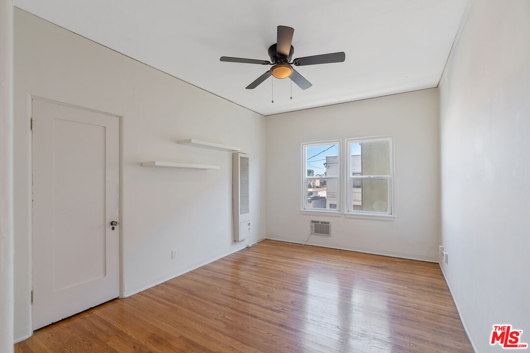 458 North Genesee Avenue Los Angeles, CA 90036 - Photo 25 of 38 a view of empty room with wooden floor and fan