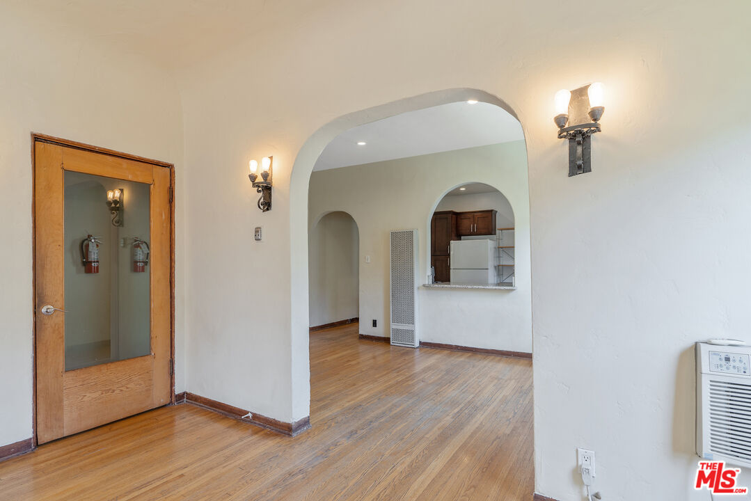 458 North Genesee Avenue Los Angeles, CA 90036 - Photo 7 of 38 a view of a livingroom with wooden floor and staircase