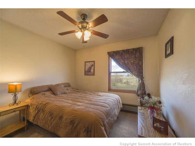 149 1018/barber Road, Unit COUNTYROAD Silverthorne, CO 80498 - Photo 8 of 12 Bedroom. Guest bedroom has views to the north.