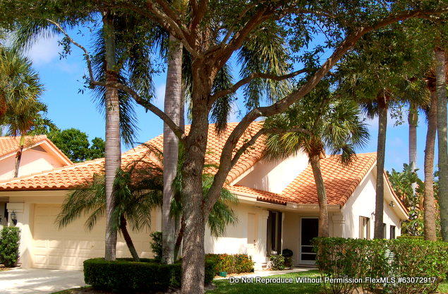 2602 Mohawk Circle West Palm Beach, FL 33409 - Photo 1 of 39 a front view of a house with a tree