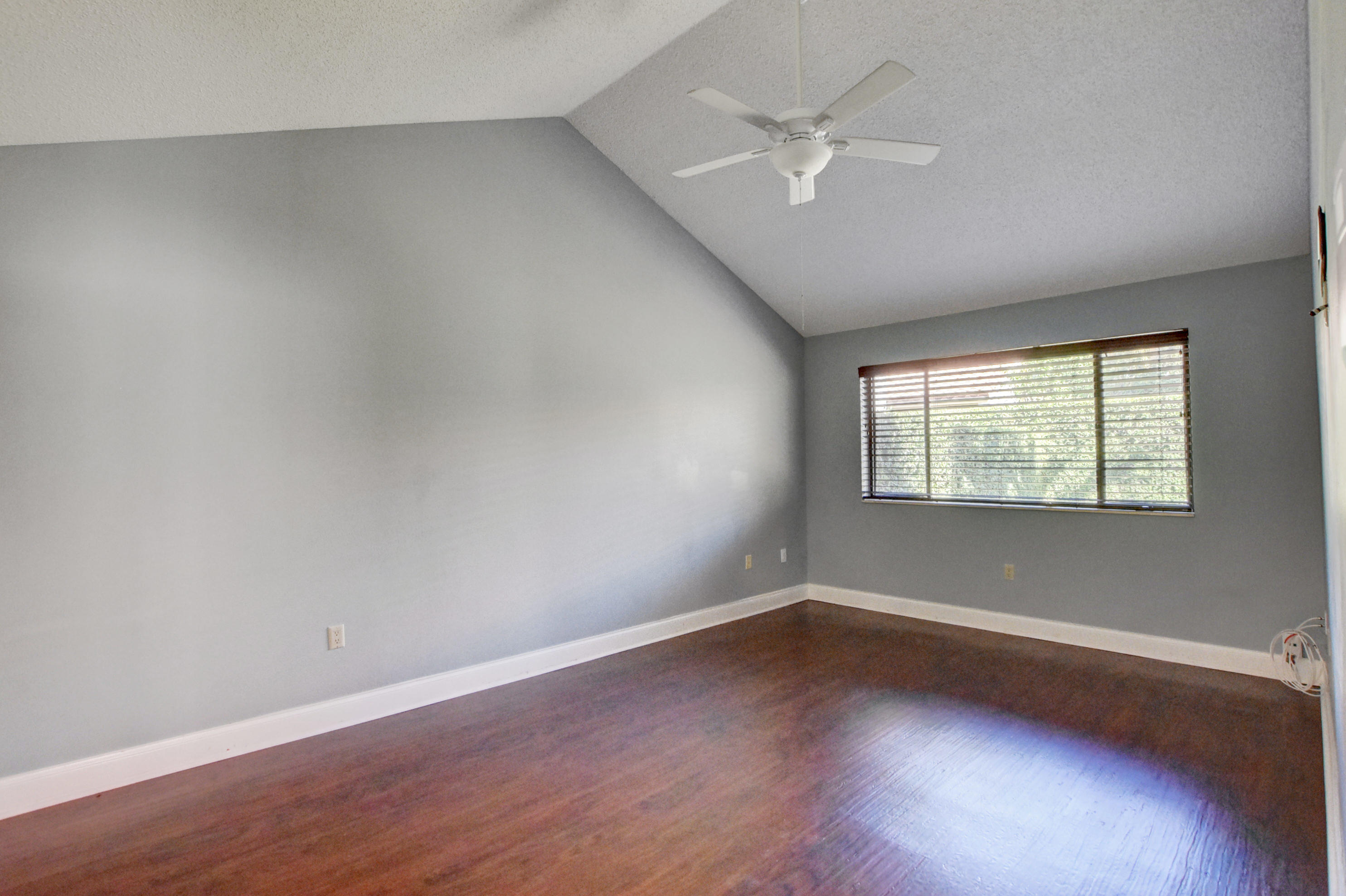 2602 Mohawk Circle West Palm Beach, FL 33409 - Photo 14 of 39 wooden floor in an empty room with a window