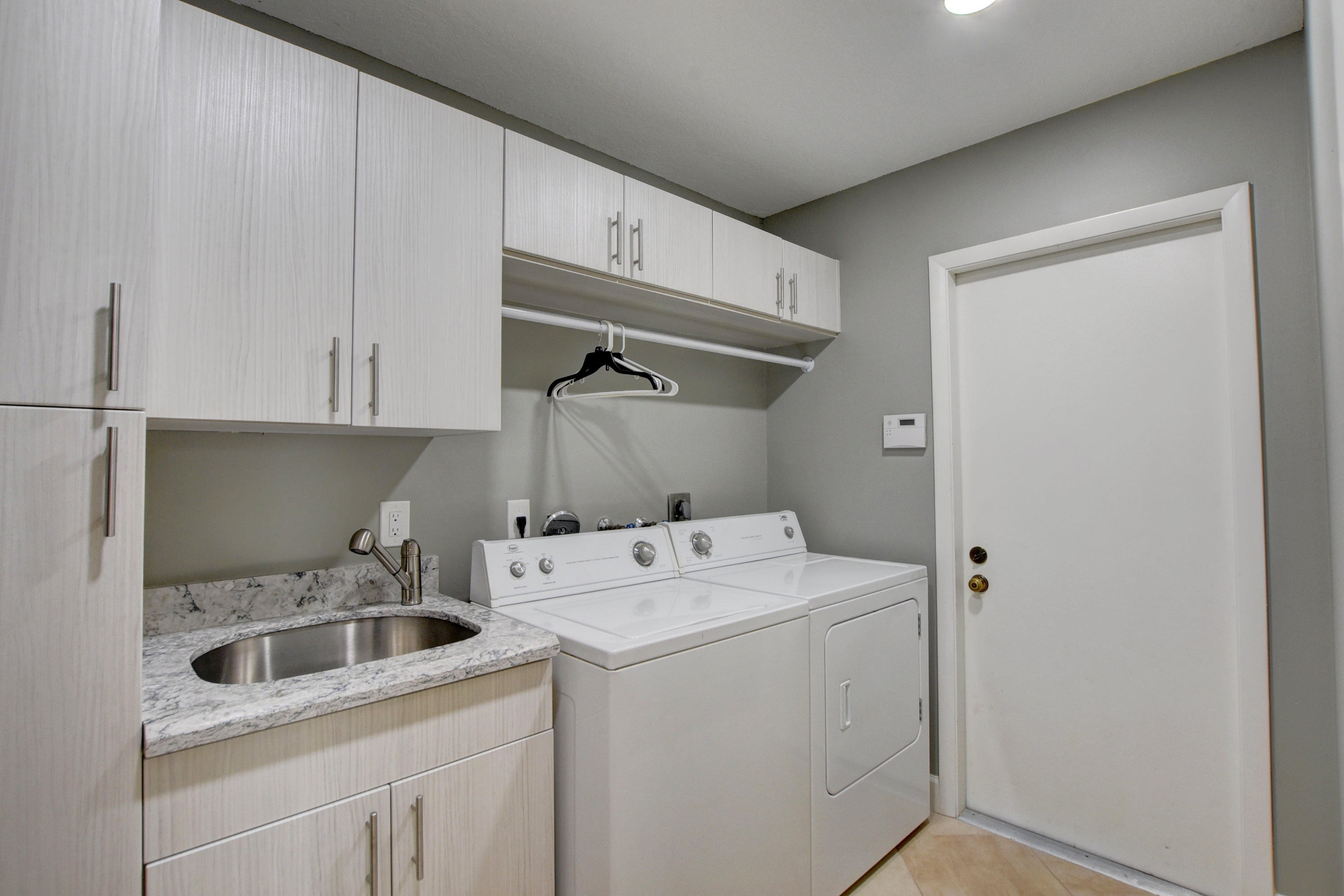 2602 Mohawk Circle West Palm Beach, FL 33409 - Photo 26 of 39 a utility room with dryer and washer