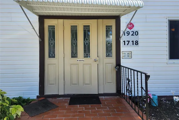 a view of a door and wooden floor