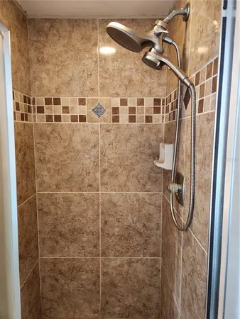 a view of balcony with table and chairs