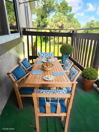 a view of swimming pool with porch and outdoor seating