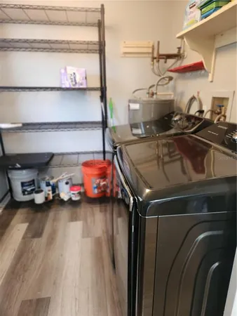 a view of a backyard with tree