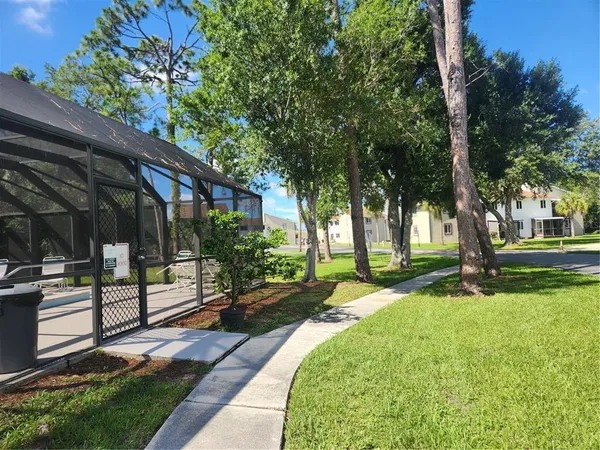 a view of a backyard with a patio