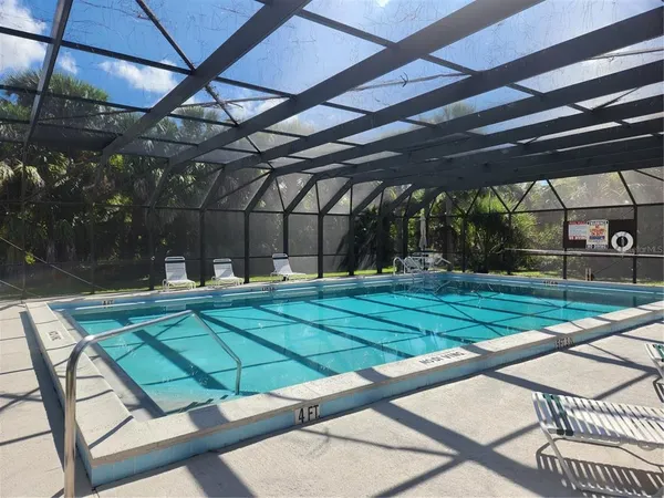 a view of a swimming pool with a patio